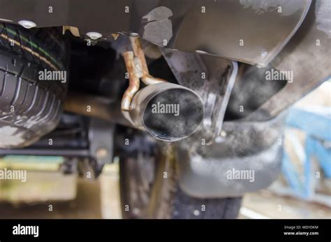 Car exhaust while leaving a smoke Stock Photo - Alamy