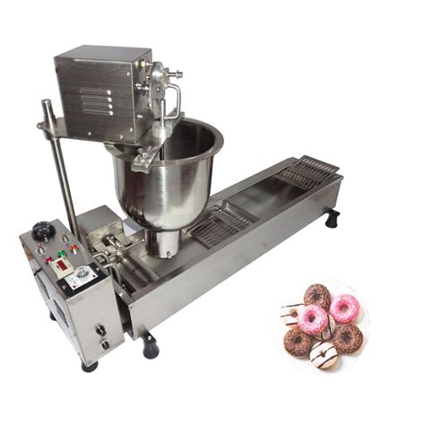 Automatic Donut Making Machine. Donuts, with their delectable flavors ...