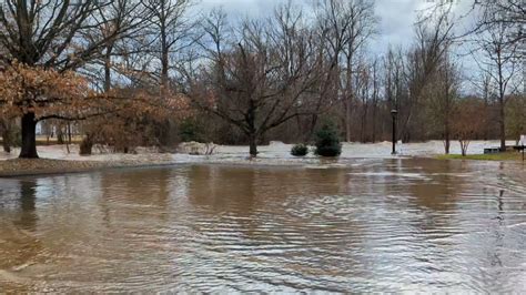 Little Pigeon River swells in Pigeon Forge behind Christmas Place ...