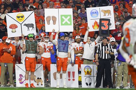 Why Do College Football Teams Hold up Signs for the Offense?