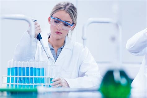 Premium Photo | Science student using pipette in the lab