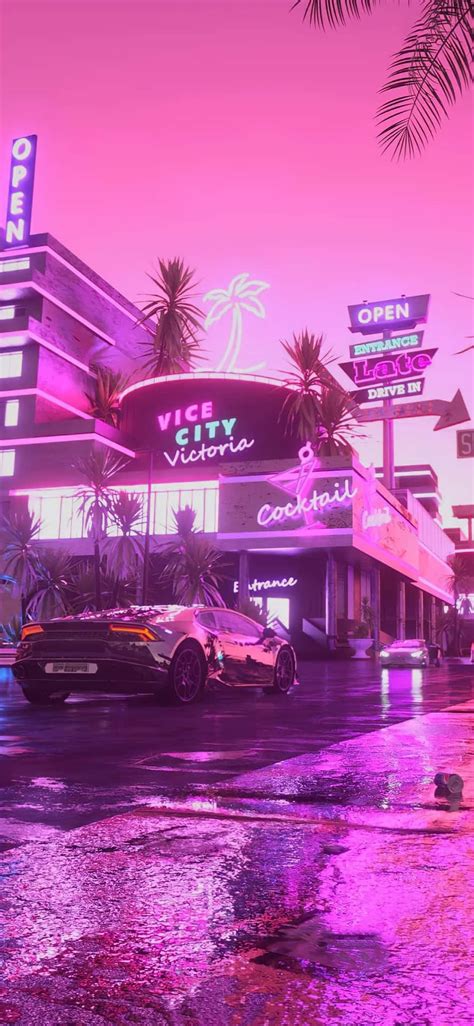 Download A Neon Lit City With Palm Trees And Cars Wallpaper ...