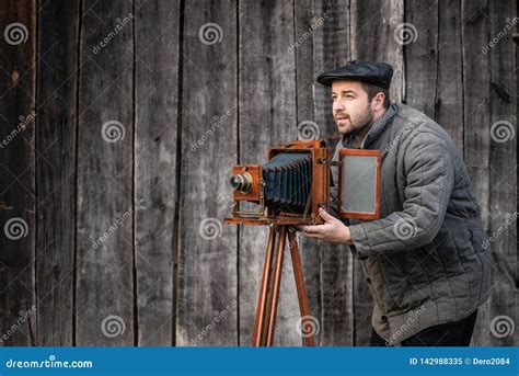 Old Fashioned Photographer Works with Large Format Camera. Concept - Photography of the 1930s ...