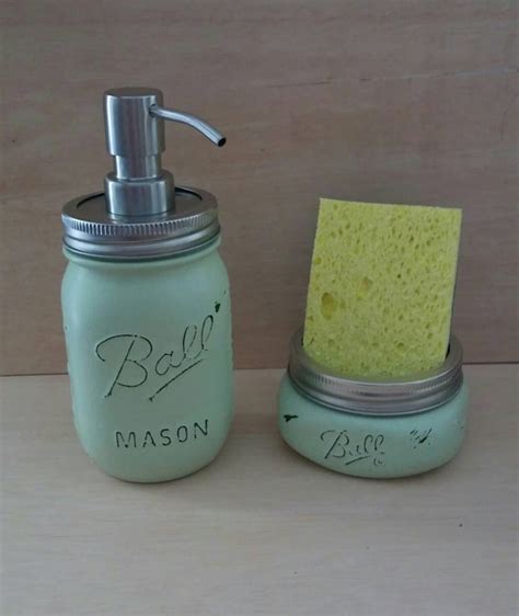 Kitchen soap dispenser and sponge holder