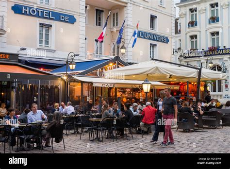 Sidewalk restaurants in the walled port city of Saint Malo in Brittany, northwestern France, EU ...