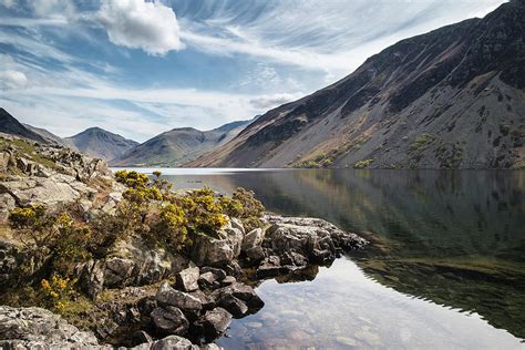 Colorful Lake District mountains landscape reflected in still la ...