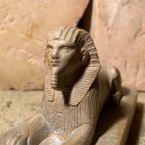 Egyptian Sphinx statue and amulet replica set. Egyptian sculpture and miniature relief