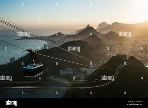 View from the Sugarloaf and the famous cable car at sunset, Rio de Janeiro, Brazil, South ...