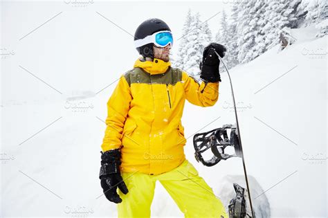 Young man with snowboard | High-Quality Sports Stock Photos ~ Creative Market