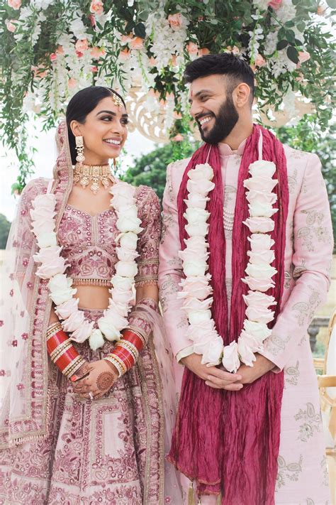 A bride and groom coordinated in stunning blush outfits at their wedding – Artofit