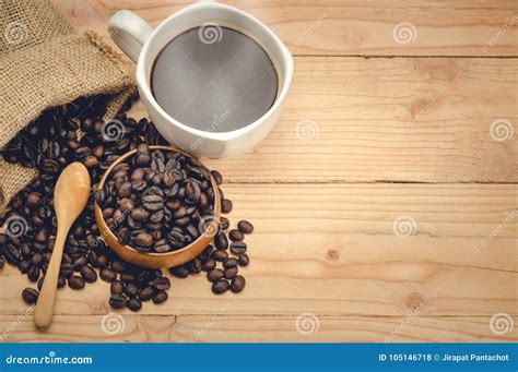 Americano Coffee and Coffee Beans on Wooden Table Stock Photo - Image of beverage, food: 105146718