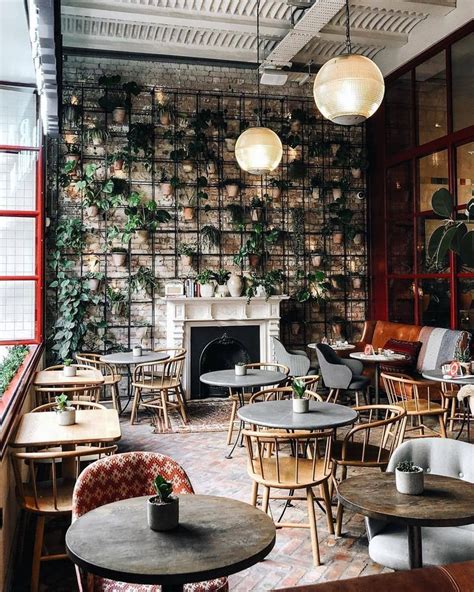 Love the plant wall | Cafe interior design, Coffee shop decor, Cafe decor