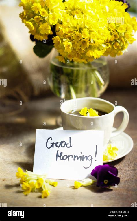 Cup o tea and spring flowers with good morning note Stock Photo - Alamy