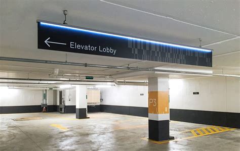 Parking garage signage by Forge Media + Design at Eau Claire Tower in Calgary | Parking design ...