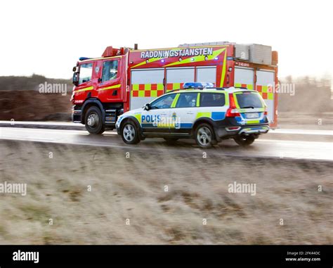 A police car and a rescue vehicle from the rescue service during an ...