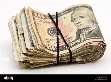 Closeup of a wad of American money tied together with a rubber band Stock Photo - Alamy