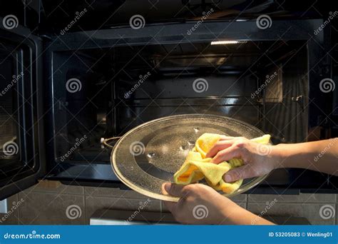 Microwave oven cleaning stock image. Image of oven, hand - 53205083