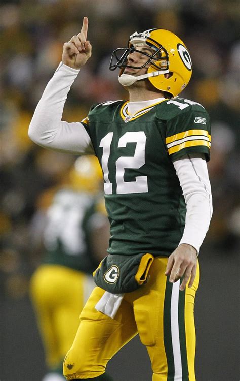 Green Bay Packers quarterback Aaron Rodgers celebrates a touchdown pass ...