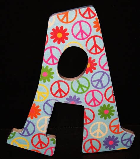 Peace sign painted letter | Decorative letters, Painted letters, Initial crafts