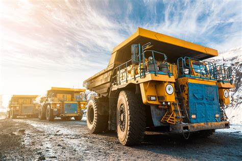 Large quarry dump truck. Loading the rock in dumper. Loading coal into body truck. Production ...