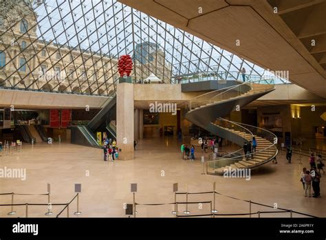 Great overview of the underground lobby of the Louvre Museum in Paris inside the Pyramid with an ...