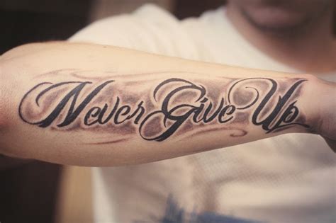 Inspire never give up quote tattoo on arm - Tattooimages.biz