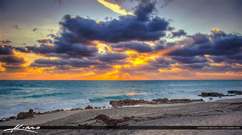 Beach Sunrise with Sunrays Through Clouds