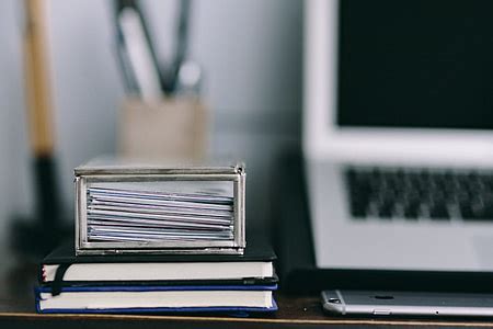 Royalty-Free photo: Black laptop computer, wireless mouse, tablet computer, and yellow ...