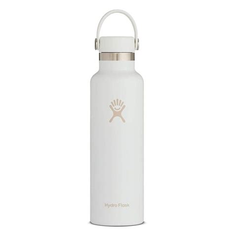 the hydro flask water bottle is white and has a gold emblem on the front