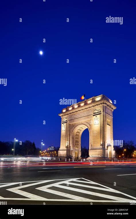 The Arcul de Triumf, a triumphial arch in Bucharest, Romania, at night Stock Photo - Alamy