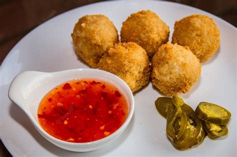 Premium Photo | Deep fried jalapeno balls with chilli sauce served in a ...