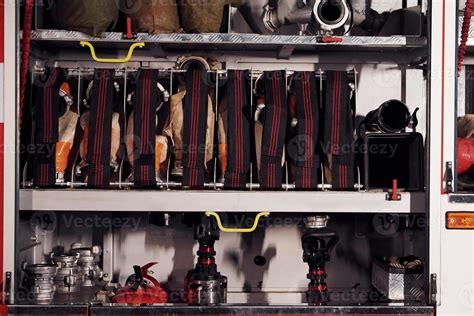 Inside of fire truck. Close up view of equipment and hoses 15360827 Stock Photo at Vecteezy