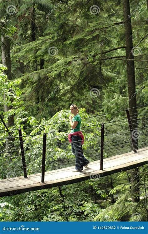 Visitors Exploring the Capilano Suspension Bridge in Capilano Park ...