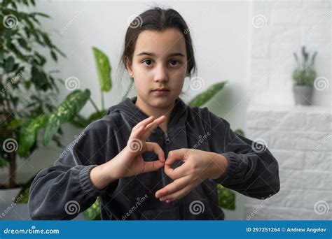 Beautiful Smiling Deaf Girl Using Sign Language. Stock Photo - Image of ...