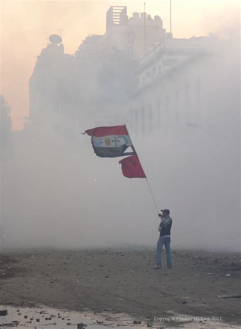 A protester defiantly waves an Egyptian flag with the embl… | Flickr