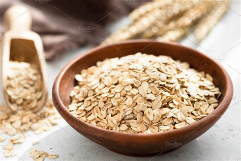 Oat flakes in bowl | High-Quality Food Images ~ Creative Market