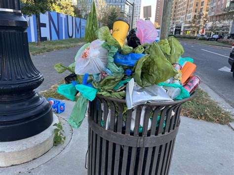 County removes ‘abandoned’ overflowing Pentagon City trash cans | ARLnow.com