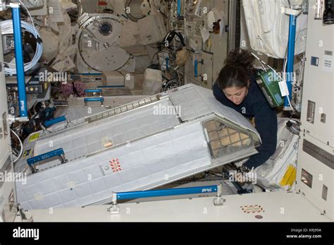 ISS-20 Nicole Stott with her crew quarters compartment in the Kibo lab ...