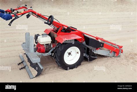 Beach cleaner machine on the seacoast Stock Photo - Alamy