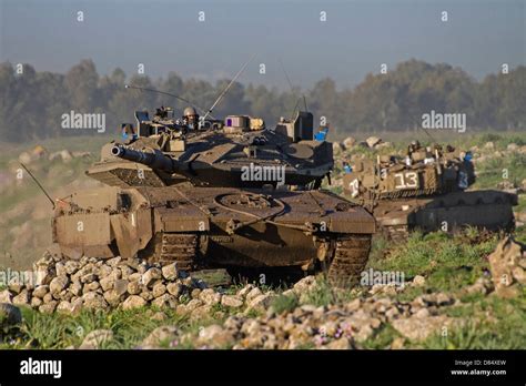 Two Israel Defense Force Merkava Mark IV main battle tanks during an exercise in the Golan ...