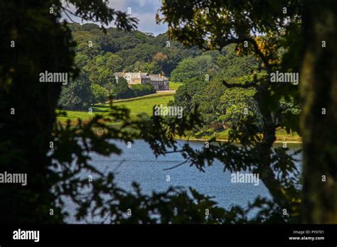 Penrose House seen through the trees at The Loe or Loe Pool, Cornwall's ...