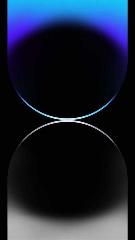 an apple logo on a black background with blue and purple lights in the ...