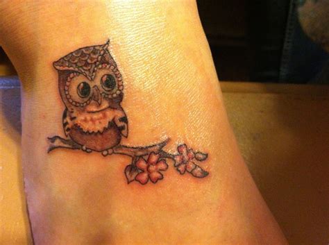 Owl Tattoo on dogwood branch | Branch tattoo, Owl tattoo, Tattoos