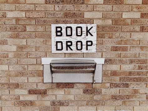 "Library Book Drop Off Sign On Building" by Stocksy Contributor "Jess ...