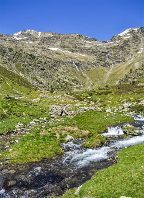 Rocky landscape with stream on mountain terrain · Free Stock Photo