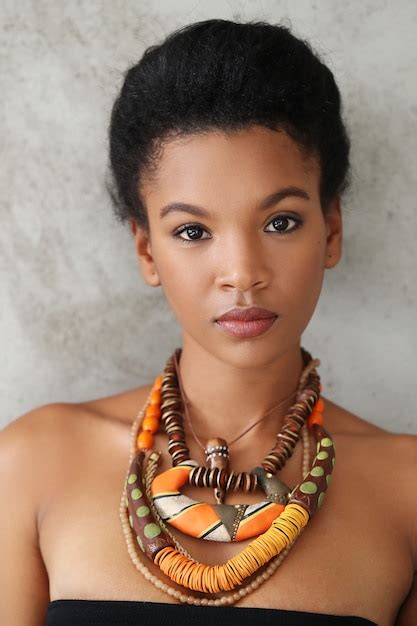 Portrait of beautiful young black woman with traditional african necklace | Free Photo