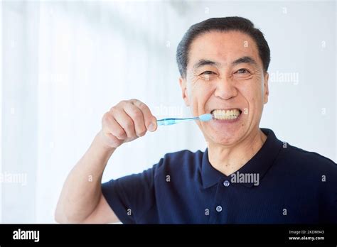 Japanese senior man brushing teeth Stock Photo - Alamy