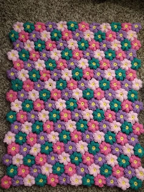 Here's my finished puff flower baby blanket! : r/crochet