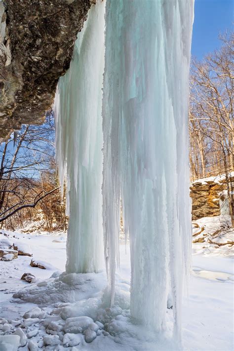 Columns of Ice - Giant icicles hang from overhanging cliffs and reach to the floor of a canyon ...