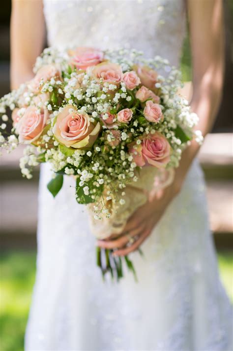 Bridal bouquet using baby's breath, light pink roses and lace. #flowers #weddingbouquets # ...